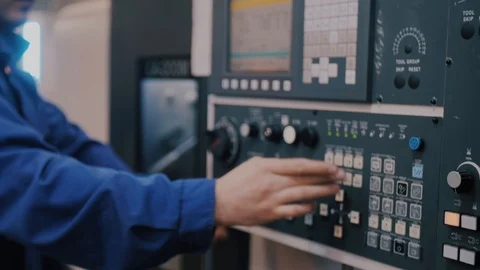 Macro control unit CNC machines and workers finger sets the program command Stock-Footage 104878796