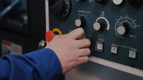 Macro control unit CNC machines and workers finger sets the program command Stock Footage 104878836