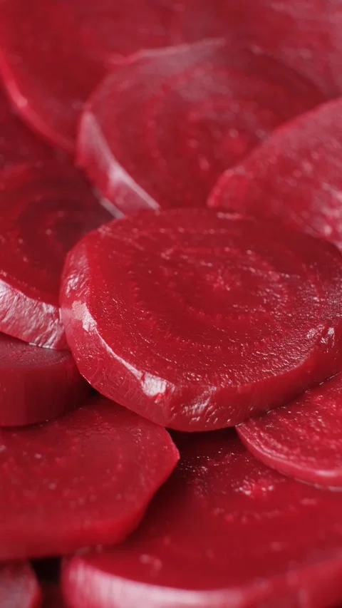 Macro of Cooked Beet Slices Showing Natural Pattern, Vertical Rotation 스톡 동영상 313749712