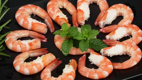 Macro of Cooked Peeled Vietnamese Whiteleg Shrimp Rotating on Plate Stock Footage 339634734