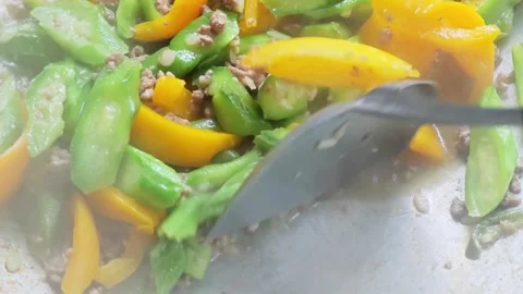 Macro cooking action of stir-fried luffa with steam. Stock Footage 341865981
