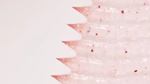 Macro cosmetic texture, sugar pink body scrub gel. Salt scrub background Stock Footage 309937616