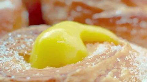 Macro croissant doughnut with lemon curd and sugar Видео 330757729