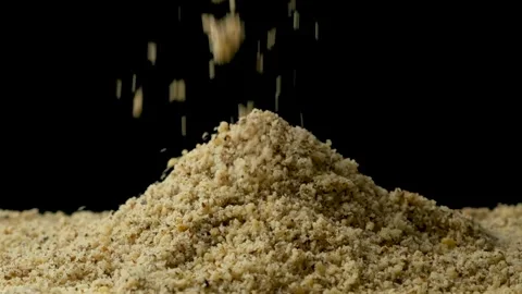 Macro crushed walnut kernels pour vertical slow motion Stock Footage 326348805