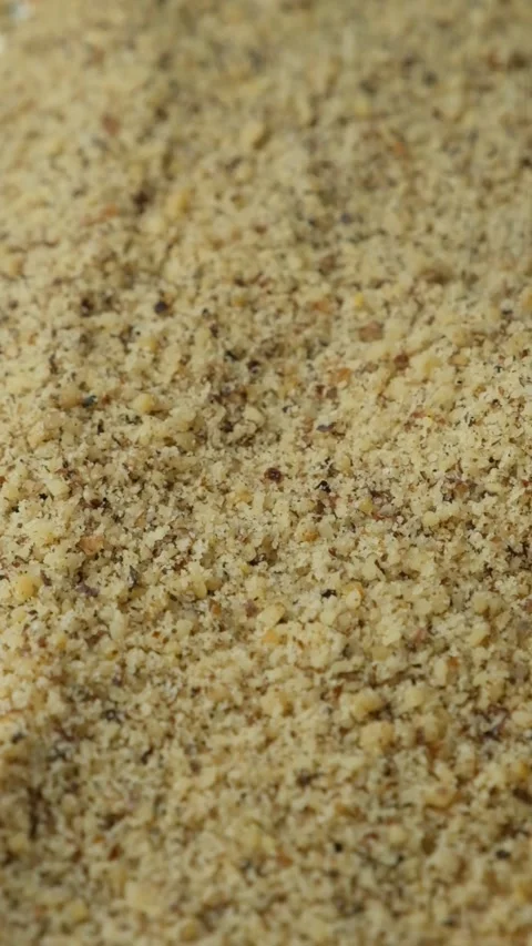 Macro crushed walnut kernels pour vertical slow motion Stock Footage 327148446