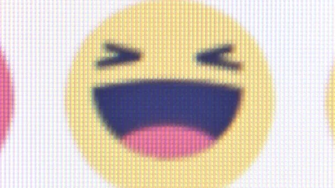 Macro CU pan across Facebook emoticons near Like button Stock Footage 94759561