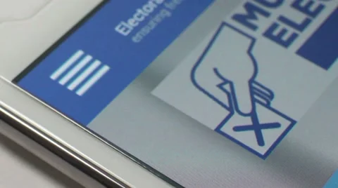 Macro CU user tapping a blue 'General Election' online smartphone voting app Video stock 63200502