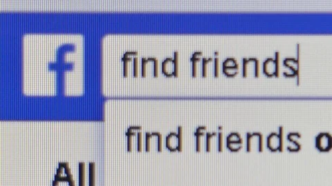 Macro CU view of Facebook user seeking to find friends using search bar Stock Footage 94724807