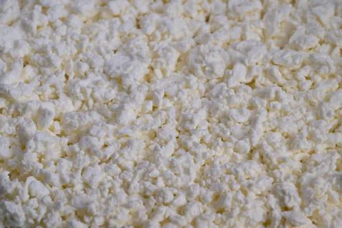 Macro curd texture pattern revealing porous white mosaic, abstract food surface Stock Photos