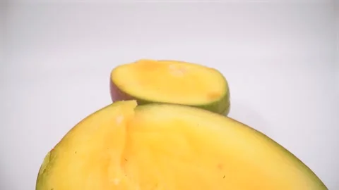 Macro of cut mango on white background isolated Stock Footage 328963138