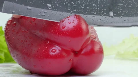 Macro cutting pepper on board with chef hands. Stock Footage 88335327