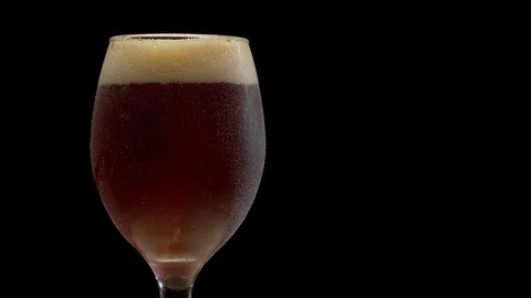 Macro dark beer in a glass Stock Footage 127448698