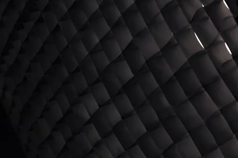 Macro of a dark photography studio softbox honeycomb grid abstract pattern. Stock Photos