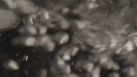 Macro Detail of Bubble and the Motion of Water in a Glass Stock Footage 208759537