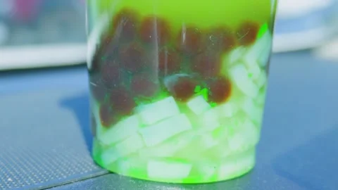 Macro detail of green bubble tea with boba pearls and jelly Stock Footage 338022114