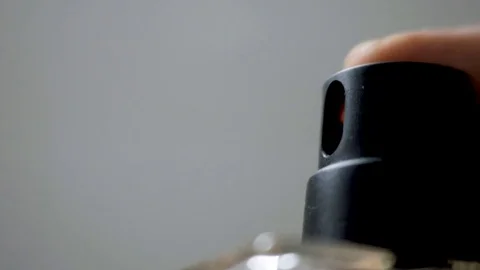 Macro detail of perfume bottle hand spraying Stock Footage 79662446