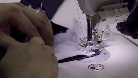 Macro Detail: Sewing Machine Stitching Puffer Jacket Padding, 4K Craftsmanship Vídeos de archivo 328308164