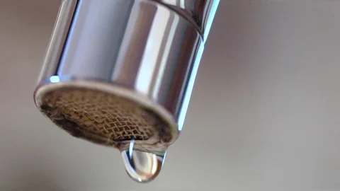Macro detail slow motion of dripping water faucet tap and dropping water drops. Stock Footage 104403633