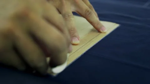 Macro Detail: Tailor Marking Fabric with Chalk, 4K Bespoke Craftsmanship Stock Footage 328308107