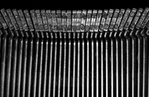 Macro detail of typescript inside electric typewriter Stock Photos