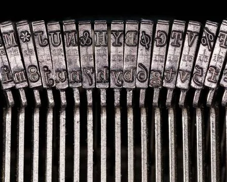Macro detail of typescript inside electric typewriter Detail of the indivi... Stock Photos
