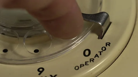 Macro - Dialing the operator on a vintage rotary phone Stock Footage 201749778