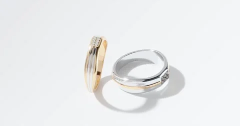 Macro diamond rings rotating realistic animation style on white background, jewe Stock Footage 272256247