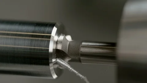 MACRO, DOF: Sharp drill bores a hole into the middle of a shiny aluminium rod. Stock Footage 113888750