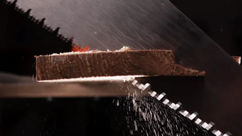 Macro DOF of sharp hand saw blade cutting through wooden beam Vídeos de archivo 329111681