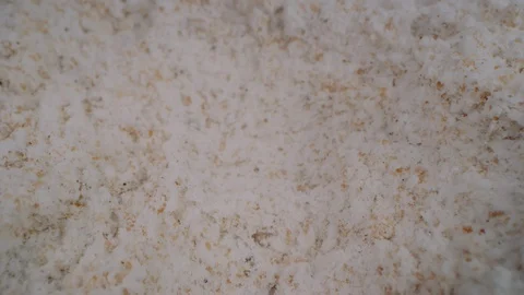 Macro dolly across flour mixture as vanilla extract pours and soaks in 스톡 동영상 129293695