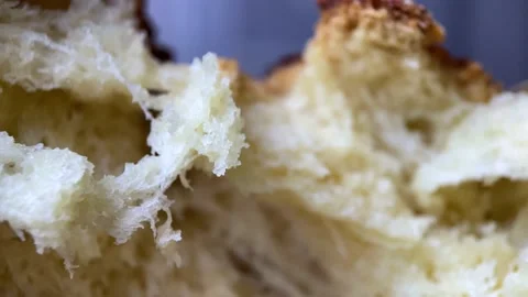 MACRO Dolly in breaking fresh baked bread. 60 FPS SLOW MOTION Stock Footage 237241029