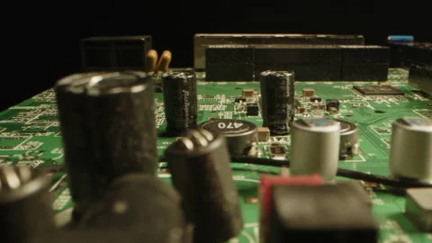 Macro dolly of a circuit board with many detailed components as diodes, chips Stock Footage 315633325
