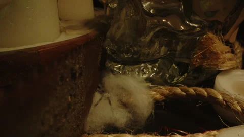 Macro dolly out of a glass skull and revealing an eerie occult altar with Video stock 336004407