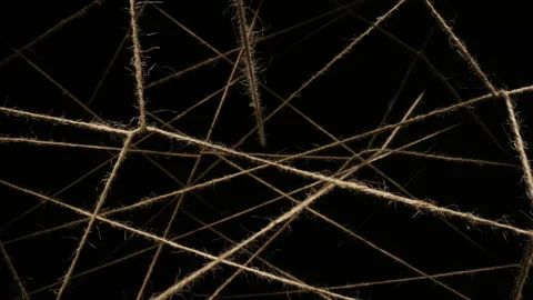 Macro dolly shot flight through sisal ropes, threads plexus chaotic interweaving Stock-Footage 263635141