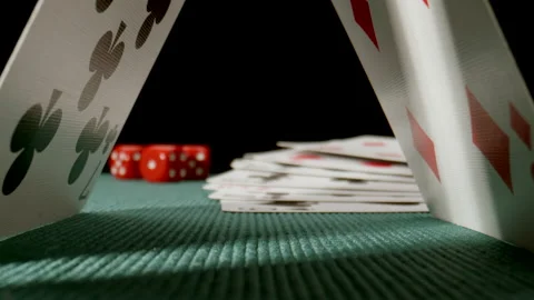 MACRO: Dolly shot under a playing cards on a green poker table Stock Footage 181797318