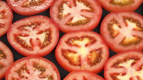 Macro Dolly Tracking Shot of Juicy Red Tomato Slices Stock Footage 342757156