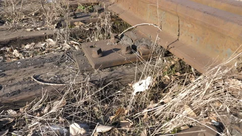 Macro Dolly View Old Rusty Rails And Wooden Sleepers On Railroad Station. Close Stock Footage 172064913