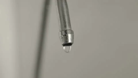 Macro, drinking water dripping intensively from the kitchen tap, leakage of a Stock Footage 212520244