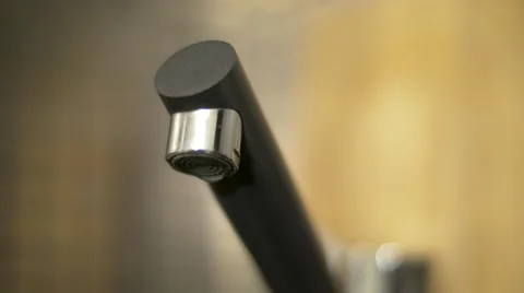 A macro of dripping kitchen faucet spout, water waste Stock Footage 59139673