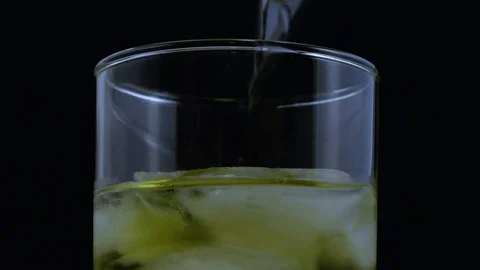Macro dropping dry ice into drink Stock Footage 70705315