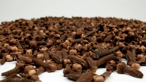 MACRO: Dry clovesd on a white background. Dolly motion Stock Footage 166029970