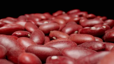 MACRO: Dry red beans grains. Healthy food. Black background. Dolly motion. Stock-Footage 144417583