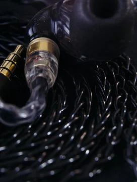Macro of in ear monitors with braided cables Stock Photos