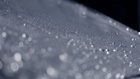 Macro edge and surface of clear plastic umbrella with slow motion rain HD Stock Footage