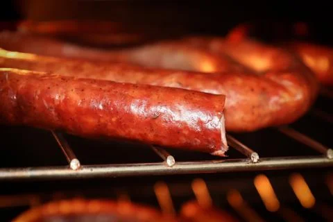 Macro of the edge of a Kielbasa on a rack Stock Photos