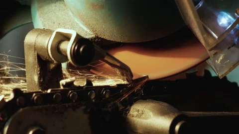 Macro of Electric Chain Sharpening For Chainsaws In Lamp Light Video stock 131313430