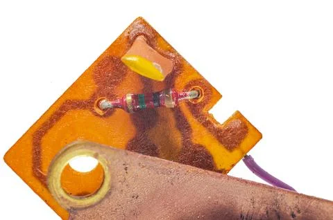 Macro of electronic circuit board with resistor yellow capacitor and copper.. Stock Photos