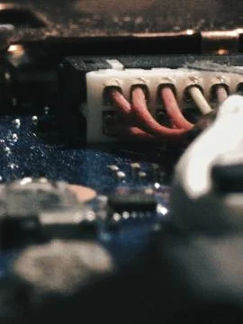Macro electronic connector on blue pcb Stock Photos