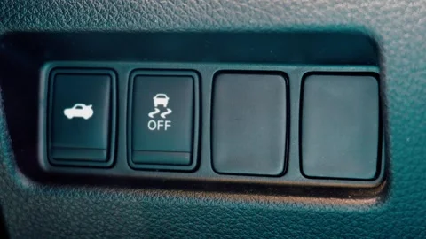 Macro of electronic stability traction control off switch in car Stock Footage 339522020