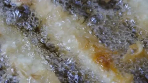 Macro Extreme Close-Up of Battered Prawns Deep Frying in Boiling Hot Oil Video stock 343027357